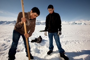 Youngsters at a fishing hole in Greenland. Photo: Lawrence Hislop, UNEP-GRID Arendal